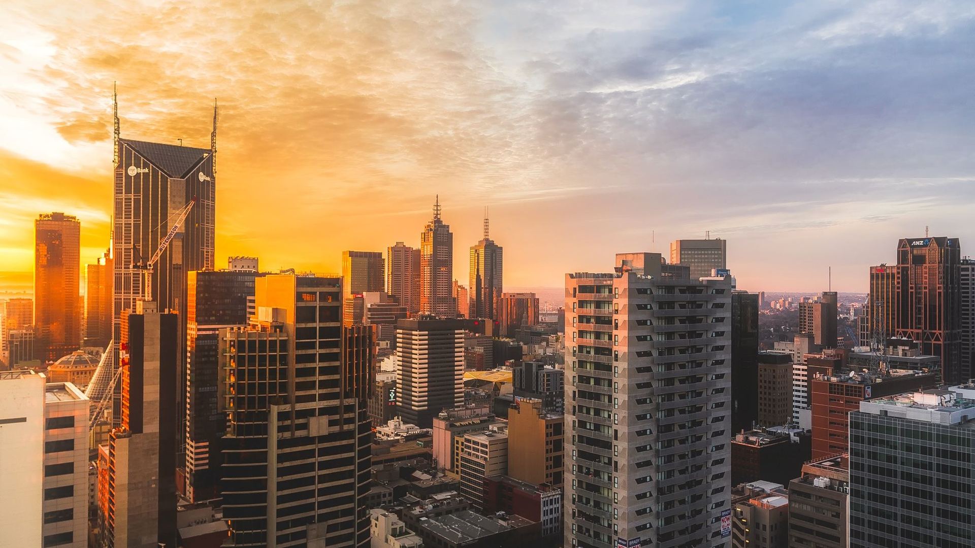 Commercial district skyline at dusk with dense office towers