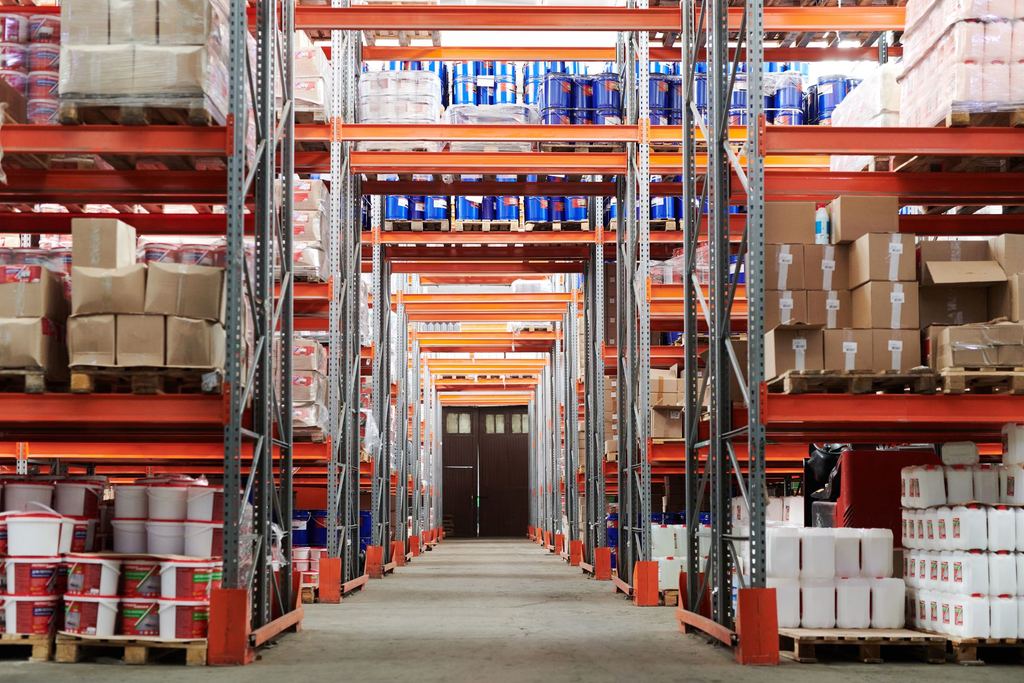 Wide aisle inside a stocked distribution warehouse